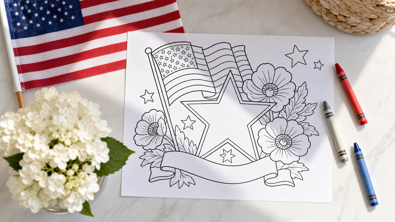 Printable Memorial Day coloring page on a table with crayons, a small flag, and flowers